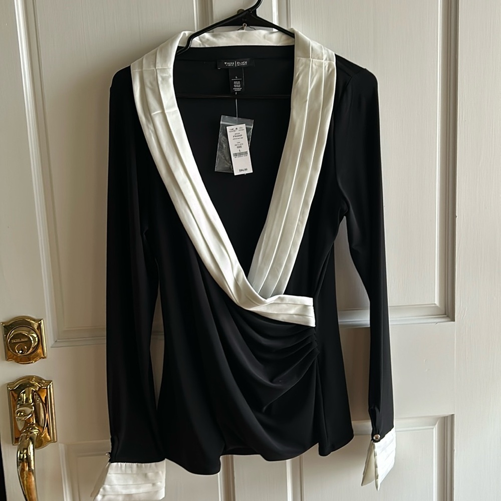 Dressy black and white top. New with tags. Size L